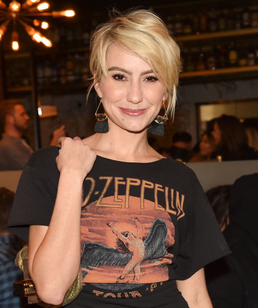Chelsea Kane smiling and posing at an event