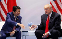 <p>Japanese Prime Minister Shinzo Abe reaches to shake hands with President Donald Trump during the bilateral meeting at the G20 leaders summit in Hamburg, Germany, July 8, 2017. (Photo: Carlos Barria/Reuters) </p>