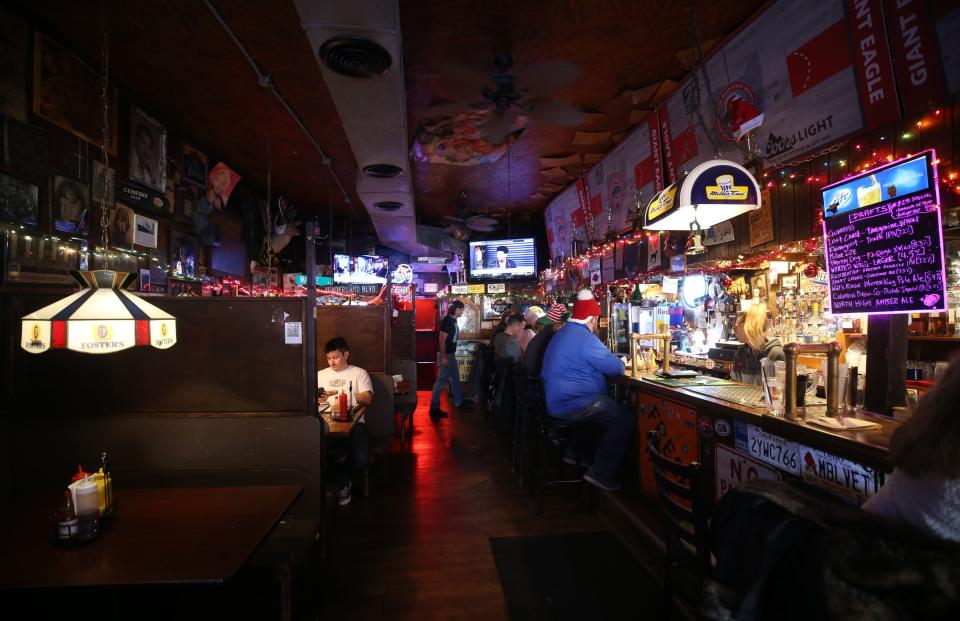 The walls of the Thurman Cafe are decorated with photos, memorabilia signs and other things.  The Thurman Cafe has been a landmark in German Village since 1942.