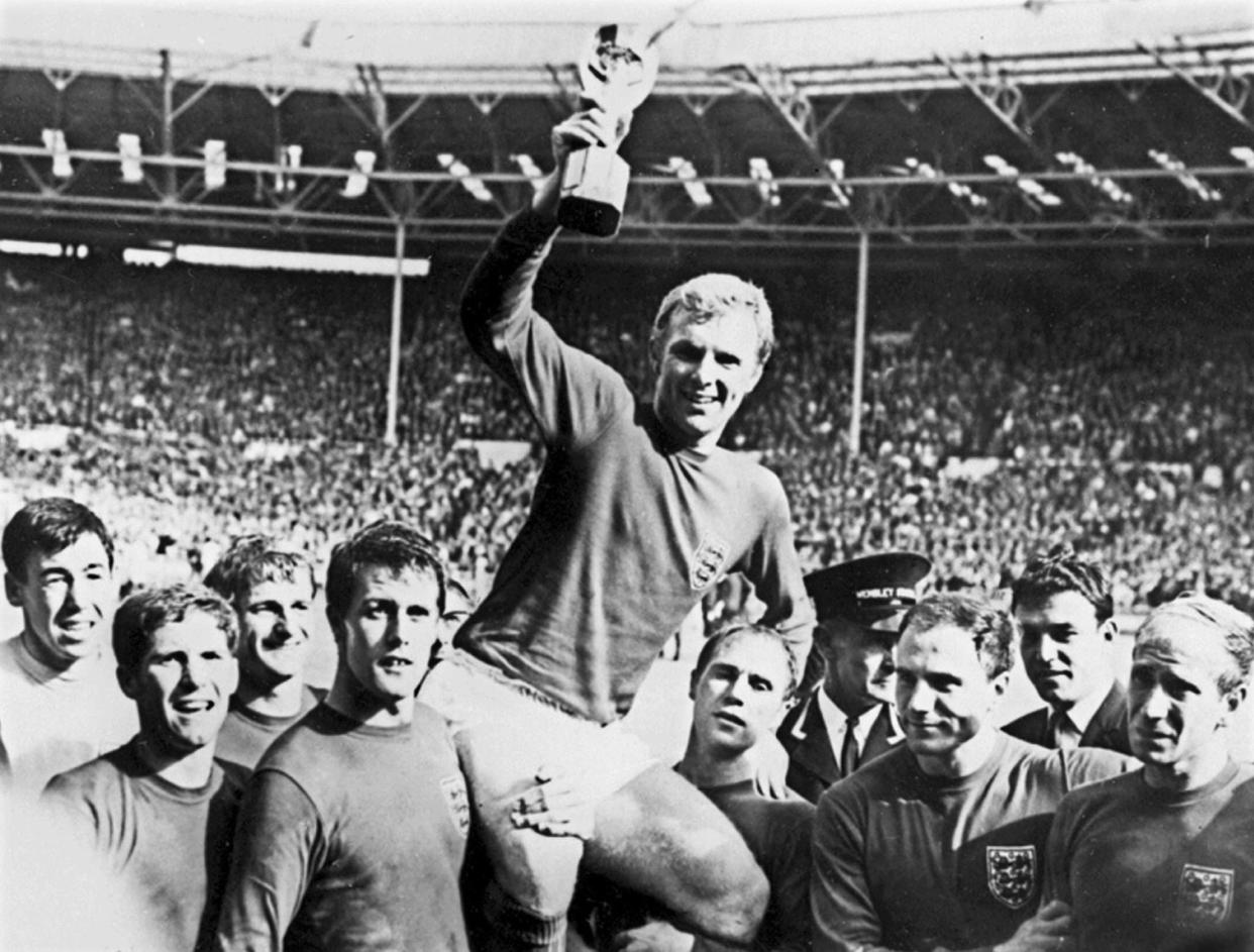 England captain Bobby Moore holds aloft the Jules Rimet trophy following England's 4-2 victory over Germany at Wembley Stadium in London.