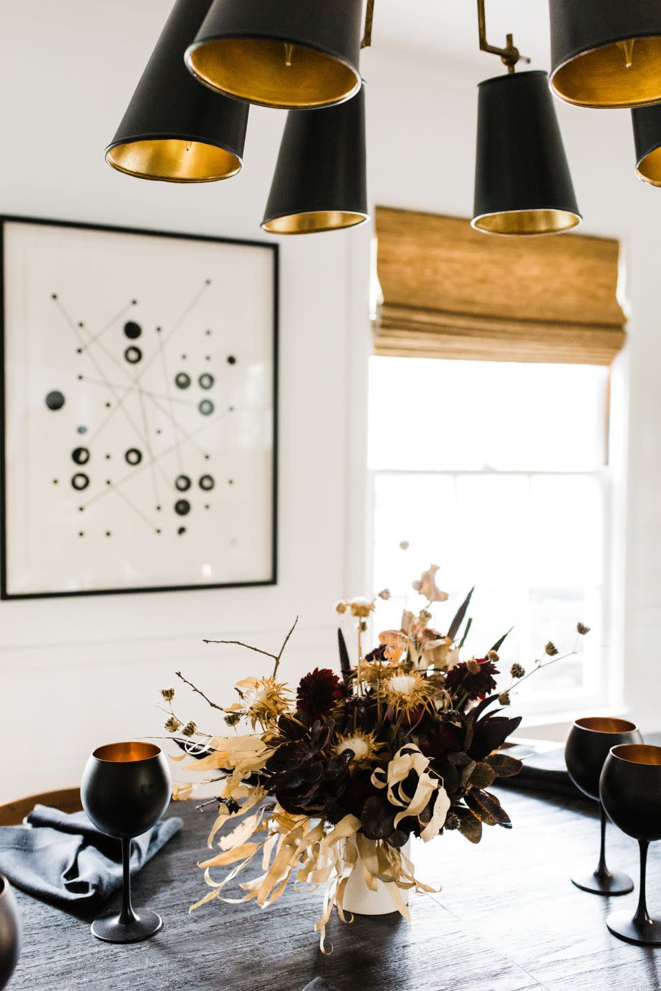 <p>Paired with inky black stemware and napkins, this moody floral arrangement by <a href="https://cheetahisthenewblack.com/living/lifestyle/grown-up-halloween-entertaining/" rel="nofollow noopener" target="_blank" data-ylk="slk:Cheetah Is the New Black;elm:context_link;itc:0;sec:content-canvas" class="link ">Cheetah Is the New Black </a>sets the scene for an elegant, grown-up Halloween dinner party. </p><p><a class="link " href="https://www.amazon.com/Black-Patterned-Wine-Glasses-FE13697905/dp/B00XGDSBHC/ref=sr_1_1?dchild=1&keywords=black+goblets&qid=1602268314&s=home-garden&sr=1-1&tag=syn-yahoo-20&ascsubtag=%5Bartid%7C10057.g.2554%5Bsrc%7Cyahoo-us" rel="nofollow noopener" target="_blank" data-ylk="slk:BUY NOW;elm:context_link;itc:0;sec:content-canvas">BUY NOW</a> <strong><em>Black Goblets, $28</em></strong></p>