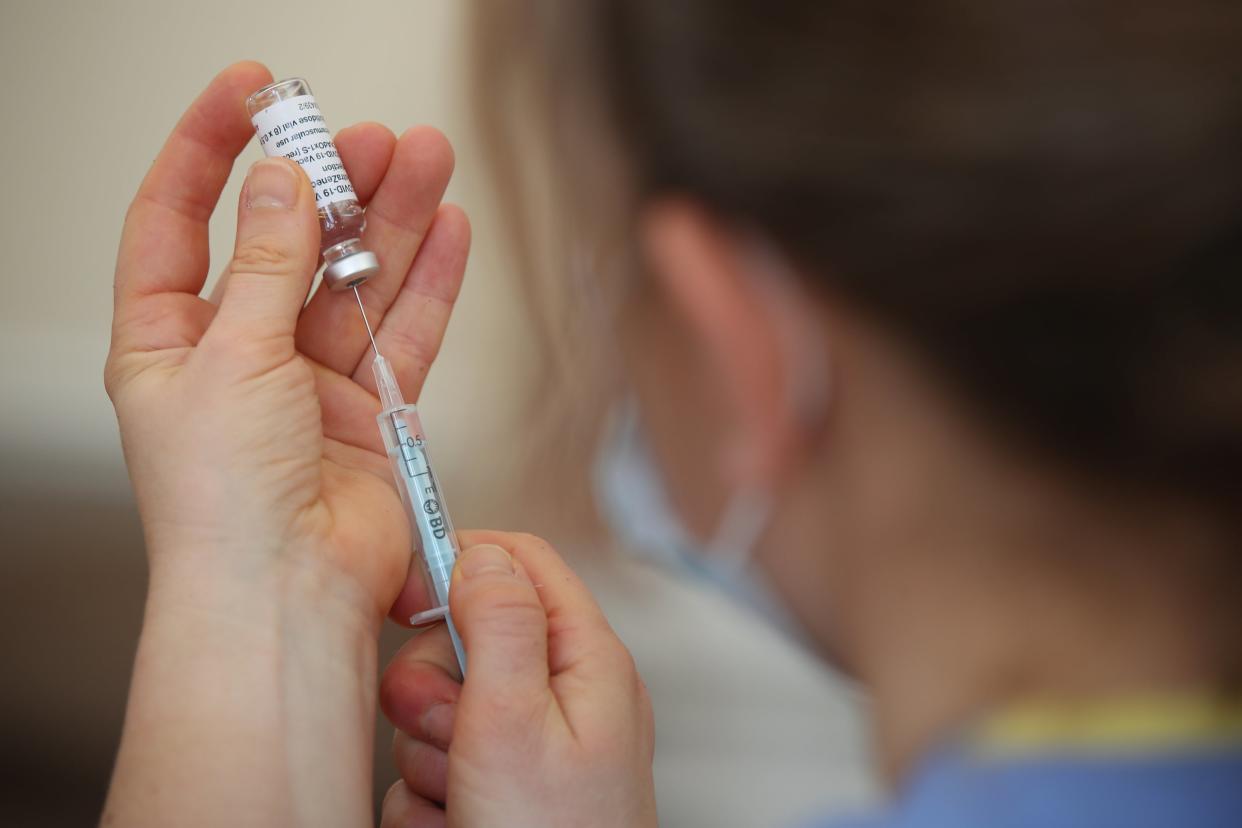 A nurse preparing a Covid-19 vaccine (Nick Potts/PA) (PA Wire)