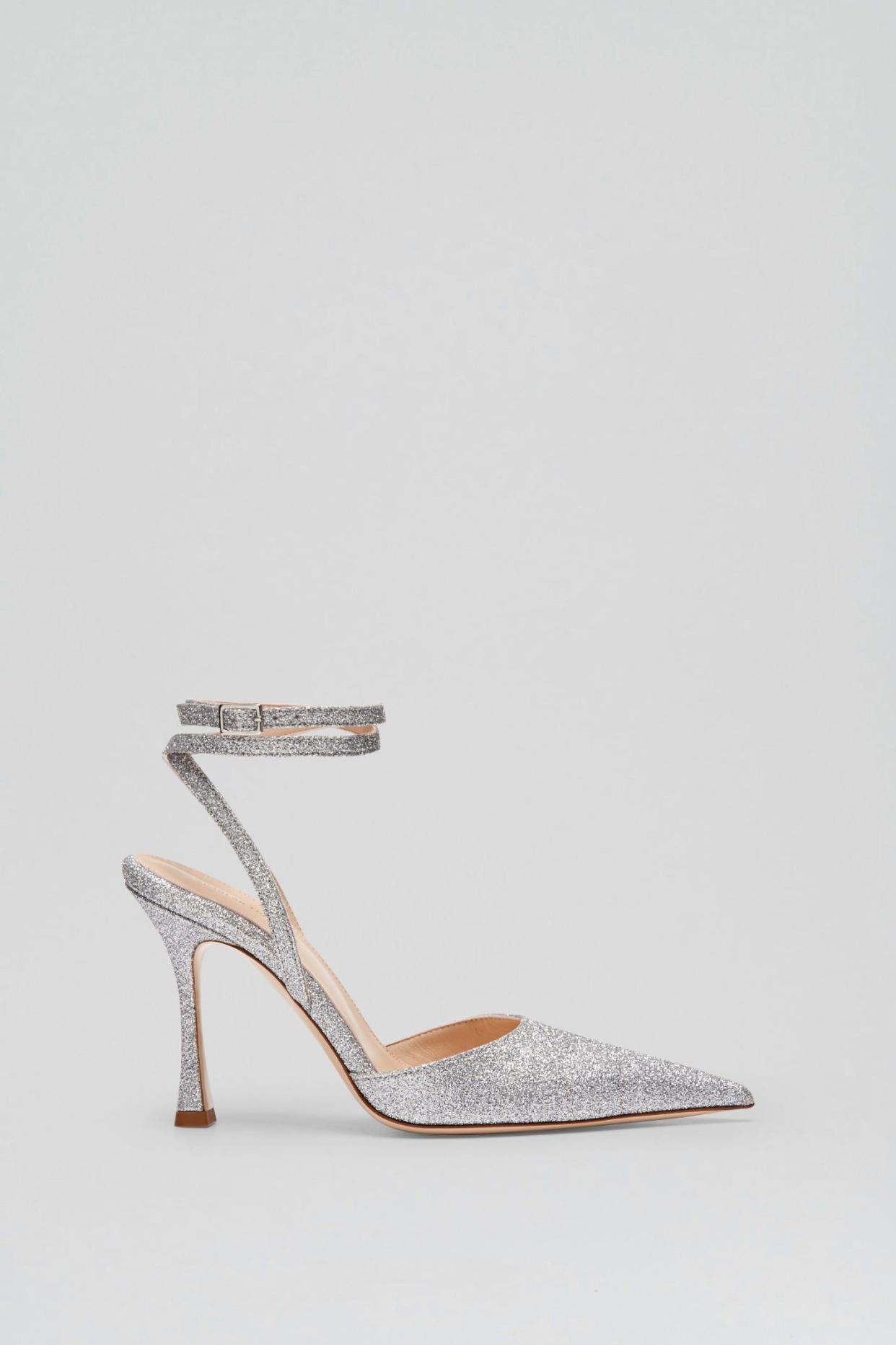 <p><a href="https://us.scanlantheodore.com/collections/shoes/products/tinsel-ankle-wrap-pump-95-silver?variant=43170428813489" rel="nofollow noopener" target="_blank" data-ylk="slk:Shop Now;elm:context_link;itc:0;sec:content-canvas" class="link rapid-noclick-resp">Shop Now</a></p><p>Tinsel Ankle-Wrap Pump</p><p>scanlantheodore.com</p><p>$650.00</p>