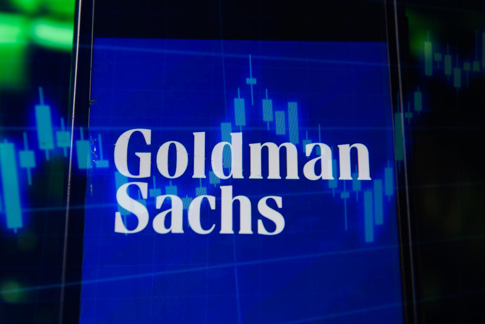 In this photo illustration a multiple exposure image shows a Goldman Sachs logo