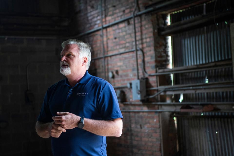 Company Distilling master distiller Jeff Arnett takes the media on a tour on Monday, May 23, 2022, of a former brick factory in Alcoa that the distillery will eventually use to store barrels and have a tasting room, restaurant, retail store and outdoor entertainment space.