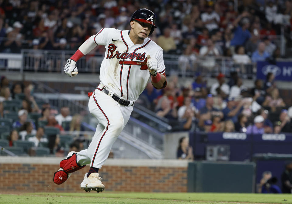 Atlanta Braves' Vaughn Grissom takes off after hitting a double during the seventh inning of the team's baseball game against the Miami Marlins on Saturday, Sept. 3, 2022, in Atlanta. (AP Photo/Bob Andres)