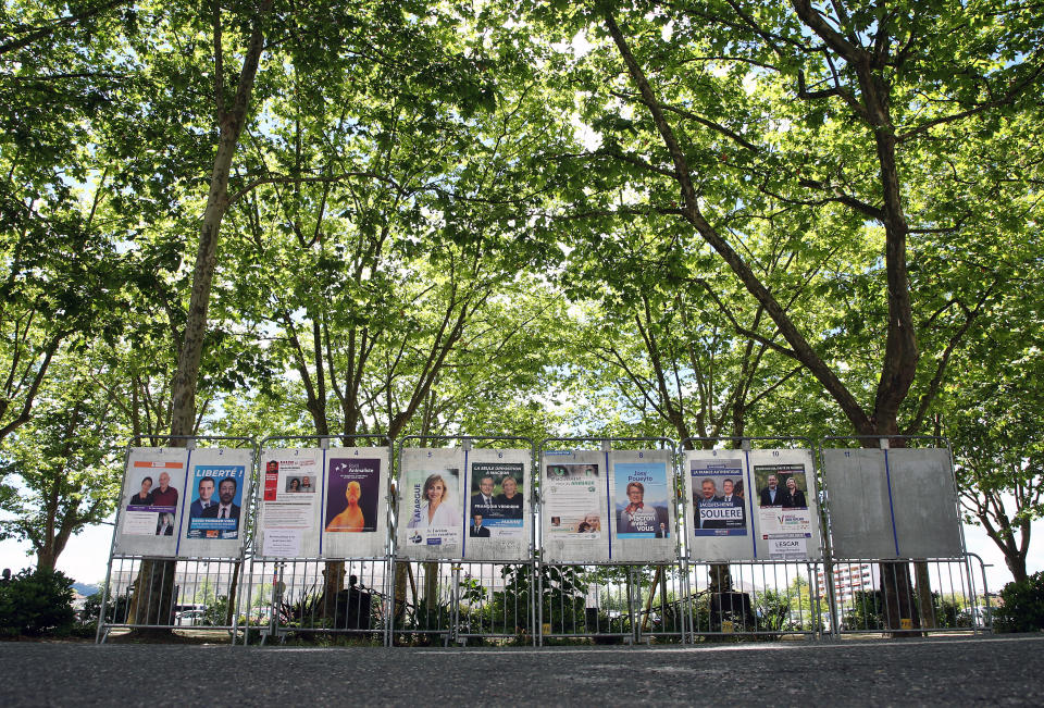 Electoral posters are displayed for the upcoming parliamentary elections in Pau, southwestern France, Thursday, June 9, 2022. The legislative elections will take place on June 12 and 19, 2022. (AP Photo/Bob Edme)