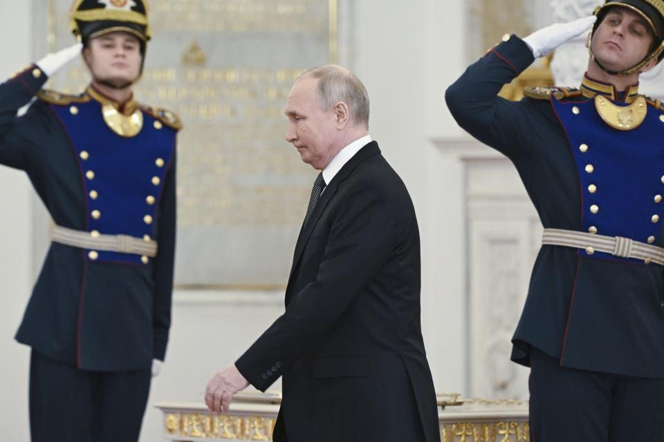 FILE - Russian President Vladimir Putin arrives at a ceremony to present medals on the eve of Heroes of the Fatherland Day at St. George Hall of the Grand Kremlin Palace, in Moscow, Russia, Friday, Dec. 8, 2023. Putin seems to be hoping that relentless military pressure, combined with changing Western political dynamics and a global focus on the Israeli-Hamas war, will drain support for Ukraine in the nearly 2-year-old war and force Kyiv to yield to Moscow's demands. (Sergei Guneyev, Sputnik, Kremlin Pool Photo via AP, File)