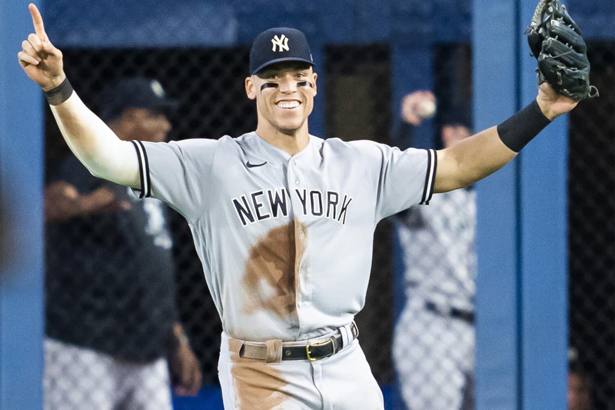 TORONTO, ON - SEPTEMBER 27: Aaron Judge #99 of the New York Yankees celebrates after defeating the Toronto Blue Jays to clinch first place in the AL East after their MLB game at the Rogers Centre on September 27, 2022 in Toronto, Ontario, Canada. (Photo by Mark Blinch/Getty Images)