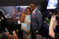 Teddy Bridgewater, from Louisville, embraces his mother Rose Murphy after being selected 32nd overall by the Minnesota Vikings in the first round of the NFL football draft, Thursday, May 8, 2014, at Radio City Music Hall in New York. (AP Photo/Jason DeCrow)