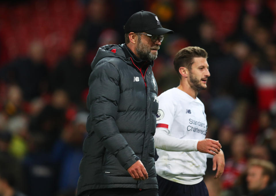 MANCHESTER, ENGLAND - OCTOBER 20: Jurgen Klopp, Manager of Liverpool and Adam Lallana of Liverpool look on during the Premier League match between Manchester United and Liverpool FC at Old Trafford on October 20, 2019 in Manchester, United Kingdom. (Photo by Catherine Ivill/Getty Images)