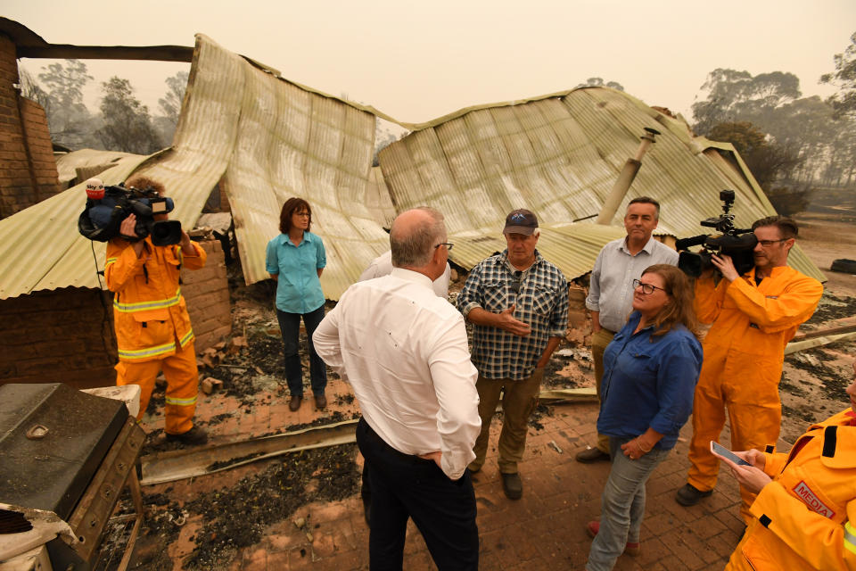 Pictured is Scott Morrison visiting a charred property in Sarsfield in Victoria. 