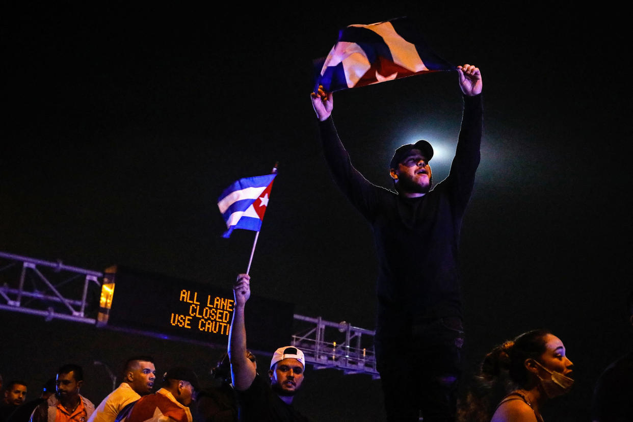 Image: People block Palmetto Expressway  in Miami, on July 13, 2021 during a rally to support Cuban protesters. (Eva Marie Uzcategui / AFP - Getty Images)