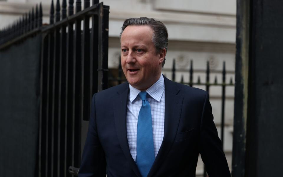 Lord Cameron, the Foreign Secretary, is pictured today arriving in Downing Street for a meeting of the Cabinet