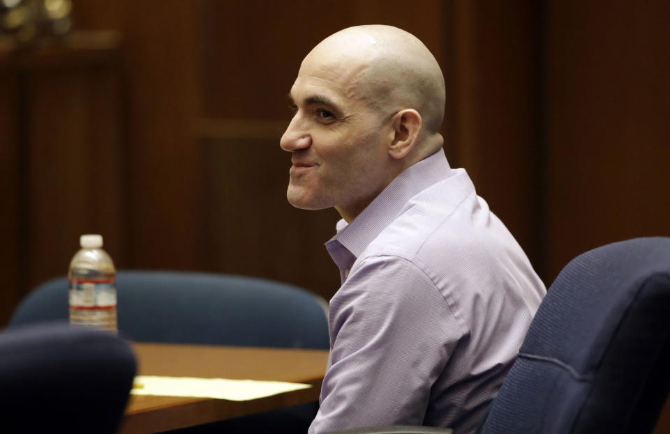 Michael Gargiulo smiles as his attorney presents closing arguments in the trial of People vs. Michael Gargiulo Wednesday, Aug. 7, 2019, in Los Angeles. Closing arguments continued Wednesday in the trial of the air conditioning repairman charged with killing two Southern California women and attempting to kill a third. (AP Photo/Marcio Jose Sanchez, Pool)