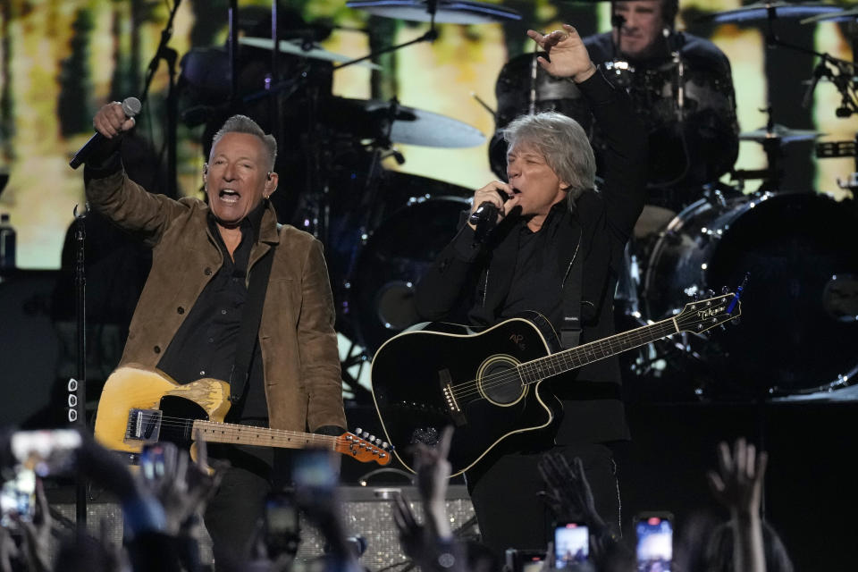Bruce Springsteen, left, and Jon Bon Jovi perform during MusiCares Person of the Year honoring Jon Bon Jovi on Friday, Feb. 2, 2024, in Los Angeles. (AP Photo/Chris Pizzello)