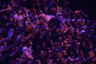 Spectators attend the semi-final of the Eurovision Song Contest at Ahoy arena in Rotterdam, Netherlands, Tuesday, May 18, 2021. The Eurovision Song Contest has been given permission to let 3,500 fans watch in person as part of a trial by the Dutch government. (AP Photo/Peter Dejong)