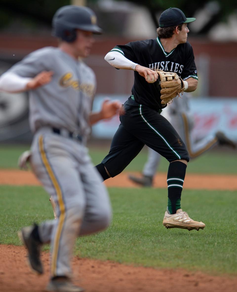 North's Cameron Decker (16) collects to make a throw to first base in the sectional semifinal game at Bosse Field Saturday morning, May 28, 2022.