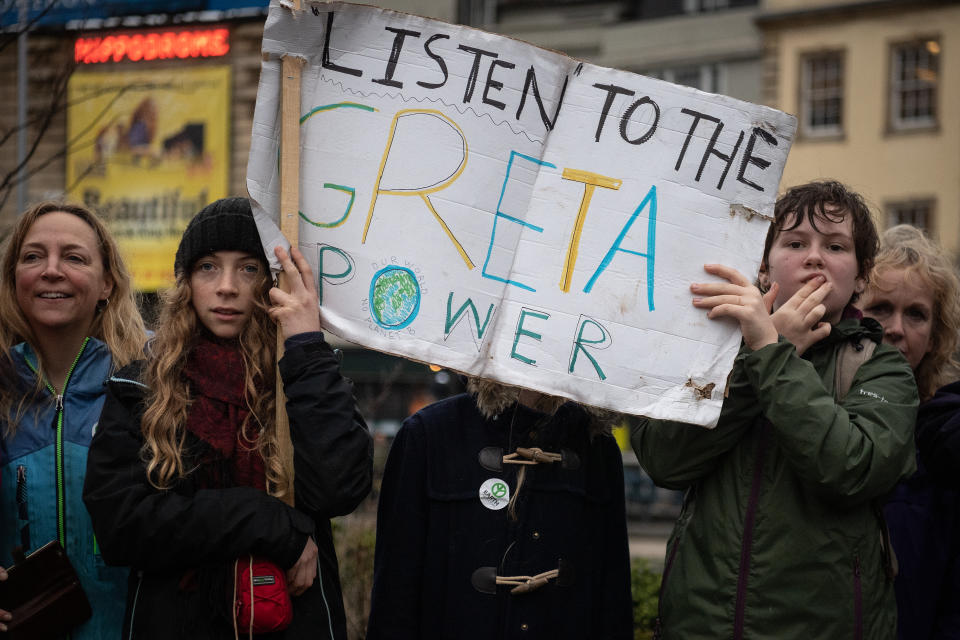 BRISTOL, ENGLAND - FEBRUARY 28: Supporters hold a banner as they wait to catch a glimpse of Swedish environmentalist Greta Thunberg as she joins demonstrators during a Bristol Youth Strike 4 Climate (BYS4C) march, on February 28, 2020 in Bristol, England.  (Photo by Leon Neal/Getty Images)