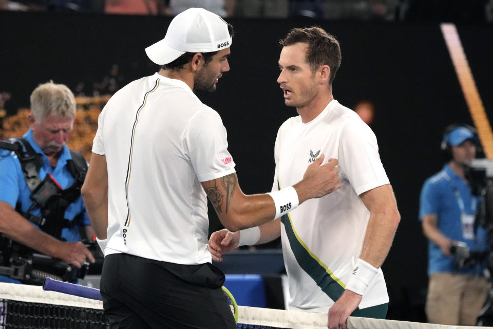 Andy Murray, right, of Britain is congratulated by Matteo Berrettini of Italy following their first round match at the Australian Open tennis championship in Melbourne, Australia, Tuesday, Jan. 17, 2023. (AP Photo/Aaron Favila)
