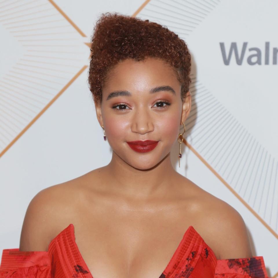 <p>Looking for more of an unconventional style like Amandla Stenberg's? At the salon, "ask for an asymmetrical high-top fade shaping at the top, keeping about one-and-a-half- to two-inches of length on the sides to allow your curls to naturally flow into sides and back," says James.</p> <p>Styling notes: use a <a href="https://www.allure.com/gallery/best-curl-creams-under-20?mbid=synd_yahoo_rss" rel="nofollow noopener" target="_blank" data-ylk="slk:curl cream" class="link ">curl cream</a> for a soft finish and touchable hold. "Apply an ample amount at your fingertips, rub together in the palms of your hands, and work it throughout your hair from root to ends, directing the curls to one side," she says. "For distinct definition, finger coil around the perimeter and at the top on various pieces for a more polished look." To balance it out, opt for a strapless dress and mismatched earrings.</p>