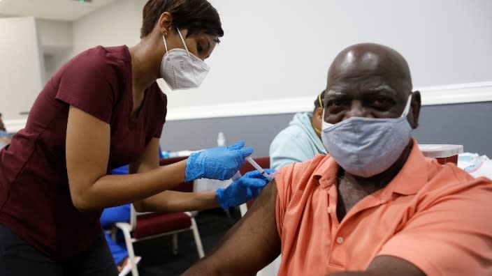 A man in Tampa, Florida gets the Moderna COVID-19 vaccination in February 2021 as part of Bible-Based Fellowship Church partnering with the Pasco County Health Department and Army National Guard to assist residents there 65 and older protect themselves from the virus. (Photo: Octavio Jones/Getty Images)