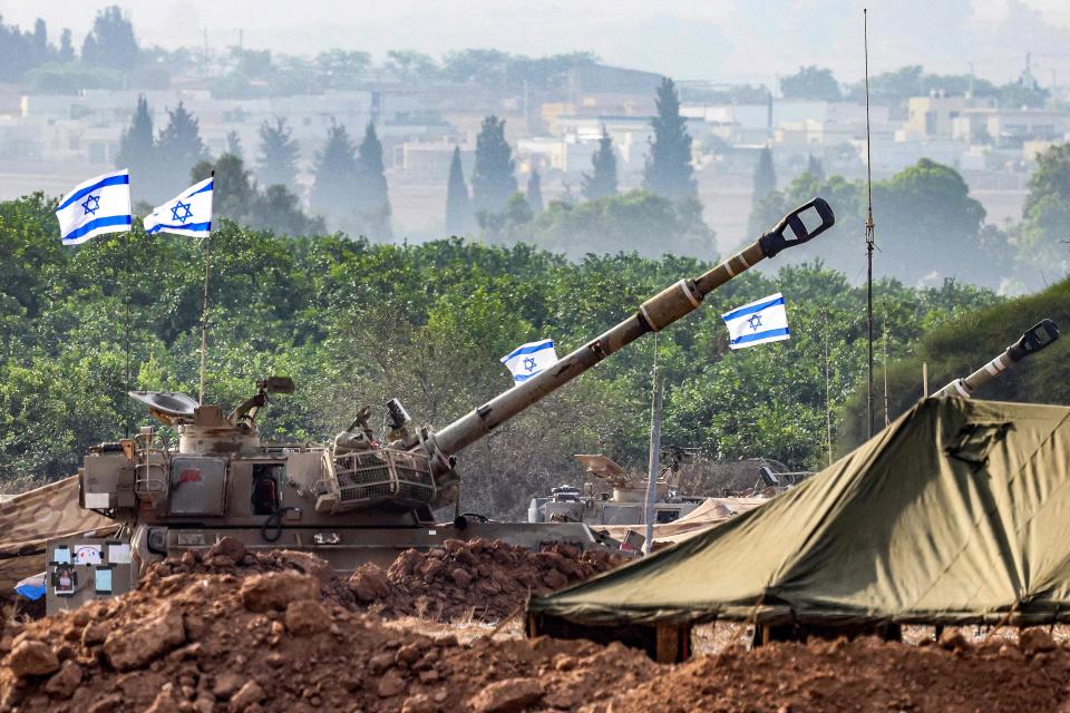 An Israeli army M109 155mm self-propelled howitzer is deployed at a position along the border with the Gaza Strip near Sderot in southern Israel on Oct. 27, 2023 amid ongoing battles between Israel and the Palestinian Hamas movement.