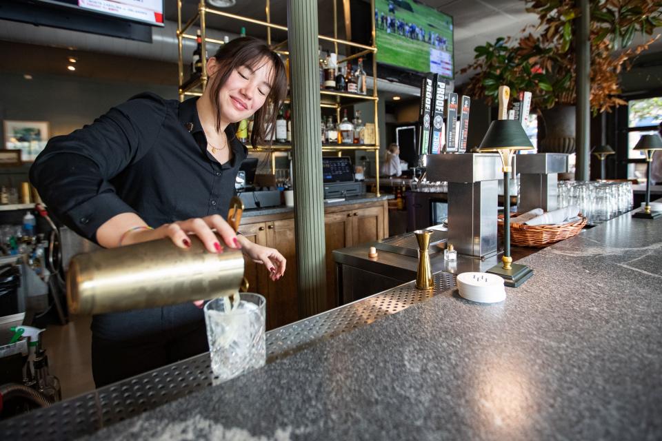 A bartender at Hayward House makes a cocktail called the Rascal Yard on Wednesday, Dec. 20, 2023.