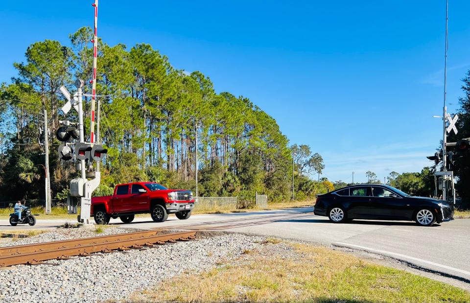 This is the at-grade Florida East Coast Railroad train crossing that leads to Ormond Crossings in Ormond Beach, pictured on Tuesday, Jan. 2, 2024. The nearly 3,000 acre mixed-use development site south of U.S. Highway 1 on both sides of Interstate 95 was sold Dec. 5, 2023 for $62 million to developer Bradford Kline. The sale did not include the FEC railroad line which runs through the development site's north end.