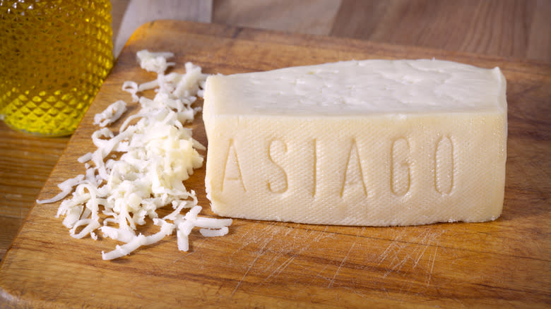 ﻿﻿asiago cheese on a cutting board