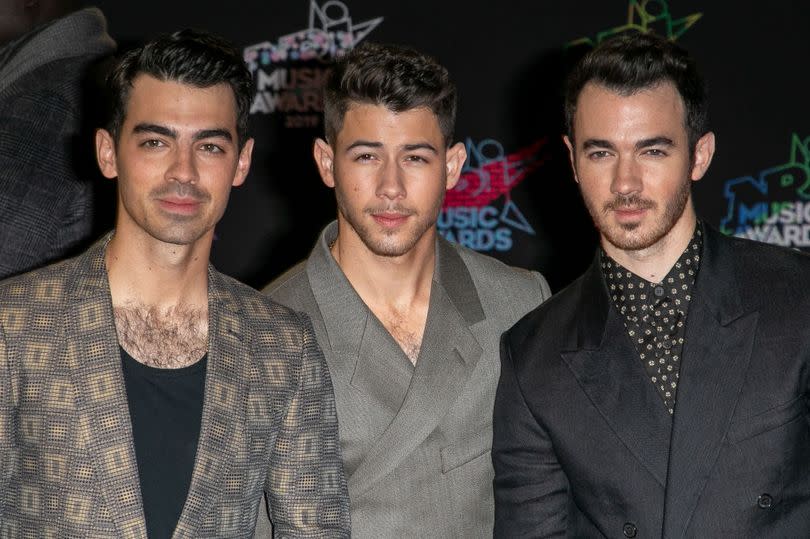 CANNES, FRANCE - NOVEMBER 09: (L-R) Joe Jonas, Nick Jonas and Kevin Jonas attend the 21st NRJ Music Awards At Palais des Festivals on November 09, 2019 in Cannes, France. (Photo by Marc Piasecki/WireImage)