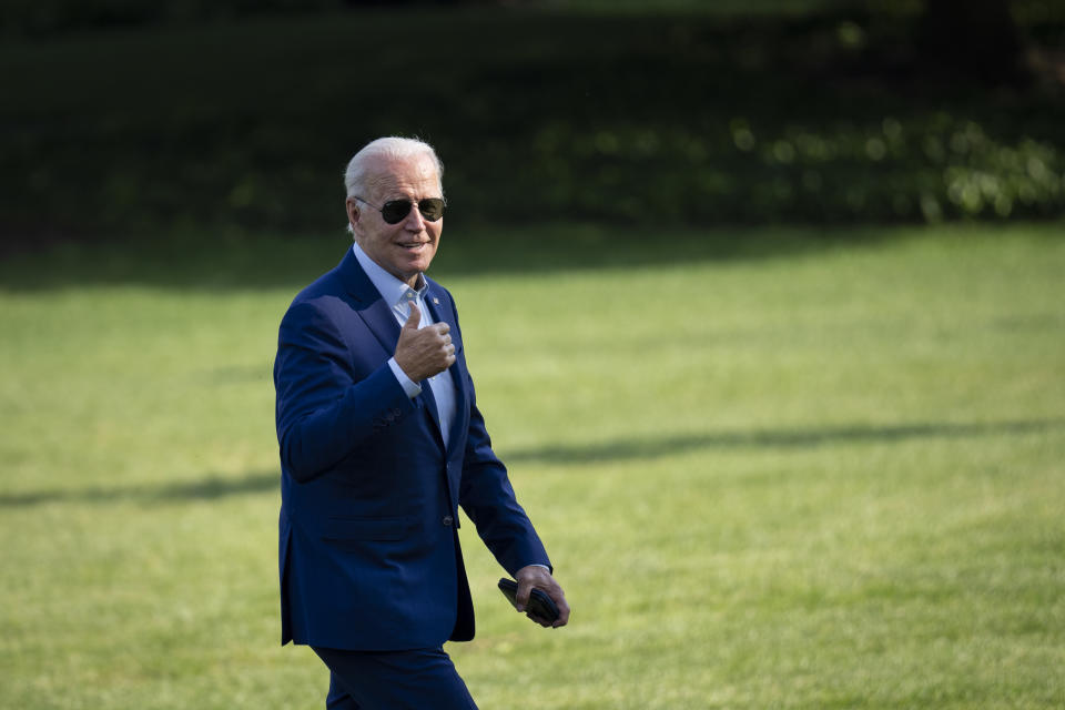 WASHINGTON, DC - JULY 20: U.S. President Joe Biden gestures toward reporters as he departs Marine One and walks to the Oval Office on the South Lawn of the White House July 20, 2022 in Washington, DC. Biden traveled to Somerset, Massachusetts to discuss his next steps on addressing climate change. He delivered remarks at the site of the now-closed Brayton Point power plant, which is being turned into the states first offshore wind manufacturing facility. (Photo by Drew Angerer/Getty Images)