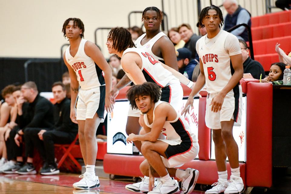 Aliquippa seniors Brandon Banks, Jayace Williams, Cameron Lindsey, Demarkus Walker and Quentin Goode reenter the game near the end senior night during the Quips game against Shenango. The Quips won the game 71-31.