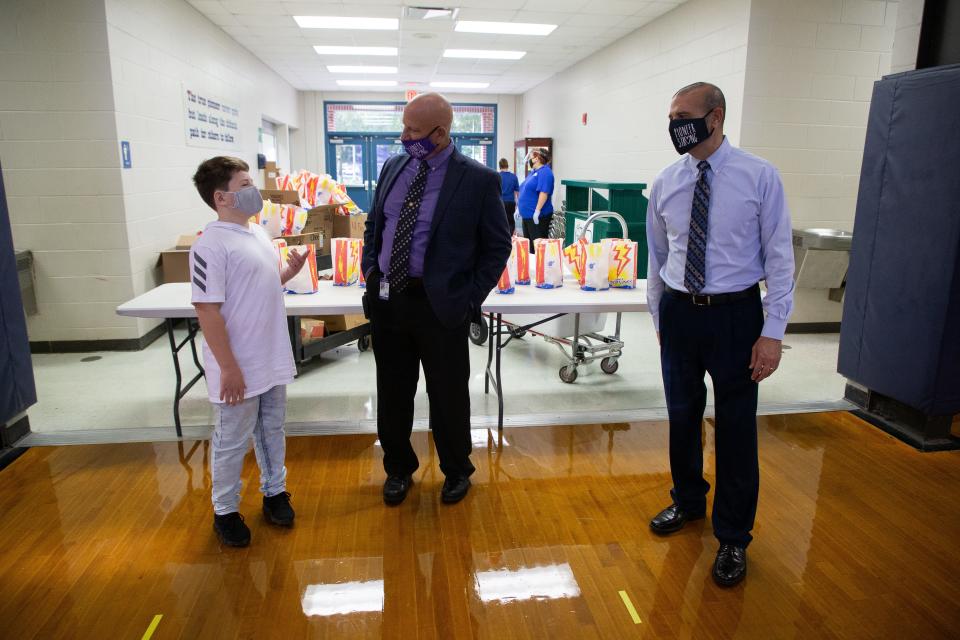 Fort Braden School Principal Jimbo Jackson and Leon County Schools Superintendent Rocky Hanna talk with a middle school in the gymnasium before the first day of school begins Monday, August 31, 2020. 