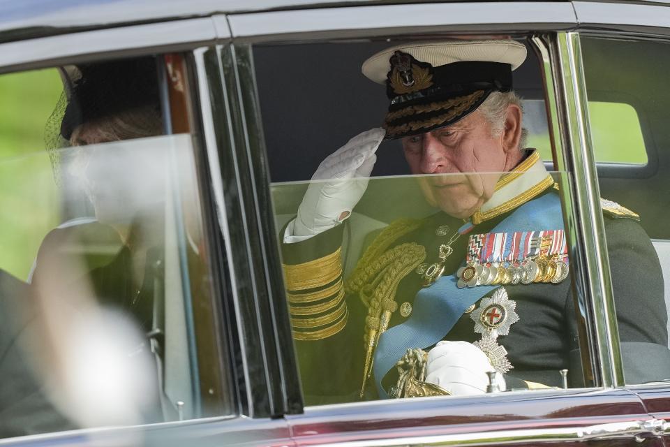 King Charles III salutes as he leaves Westminster Abbey following the state funeral service of Queen Elizabeth II in Westminster Abbey in central London Monday Sept. 19, 2022. In June, Britain celebrated Queen Elizabeth II’s Platinum Jubilee — 70 years on the throne — with parties, pageants and a service of thanksgiving. Three months later, the queen died, aged 96, at Balmoral Castle in Scotland. (AP Photo/Martin Meissner, Pool)