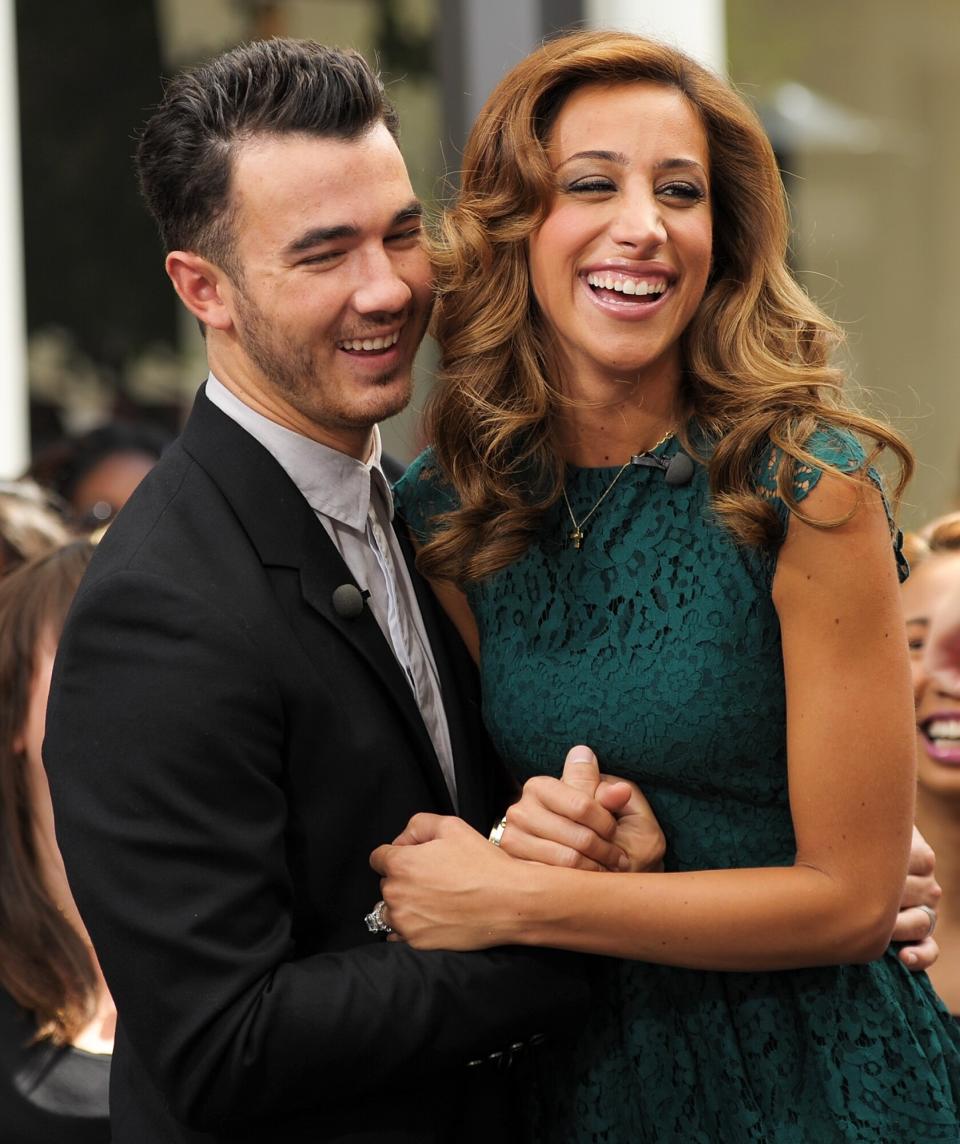 Kevin Jonas (L) and Danielle Jonas visit "Extra" at The Grove on August 16, 2012 in Los Angeles, California