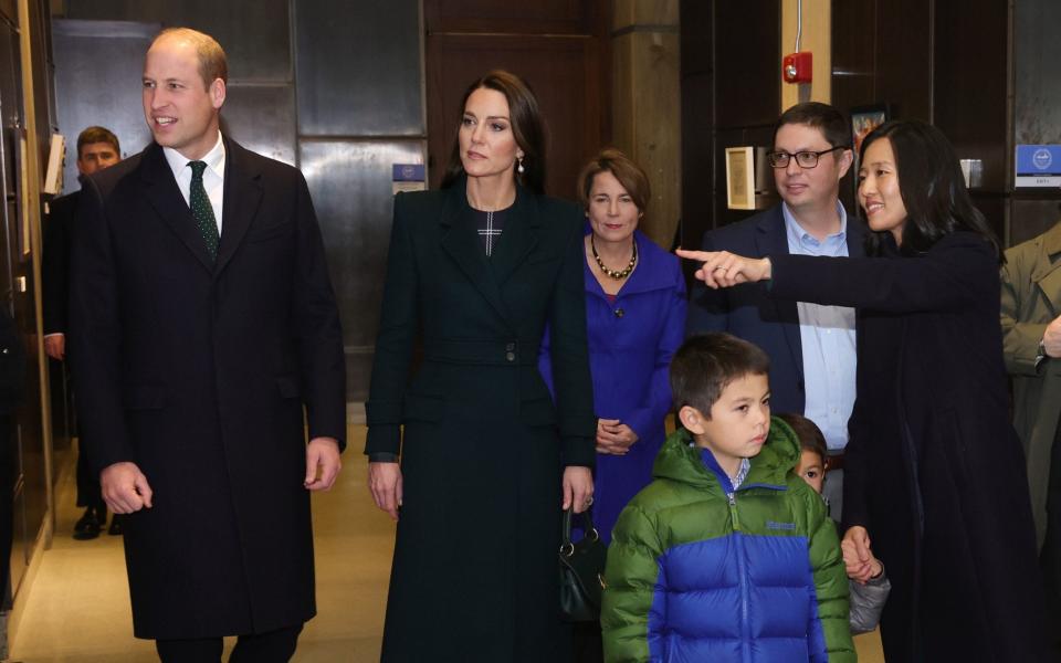 Boston Mayor Michelle Wu (right), Conor Pewarski and Governor Elect Maura Healy (centre) showed the Prince and Princess around City Hall – including memorabilia from William's grandmother's 1976 visit. - PA Wire