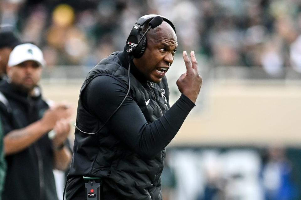 Michigan State’s head coach Mel Tucker communicates with players during the first quarter in the game against Michigan on Saturday, Oct. 30, 2021, at Spartan Stadium in East Lansing.