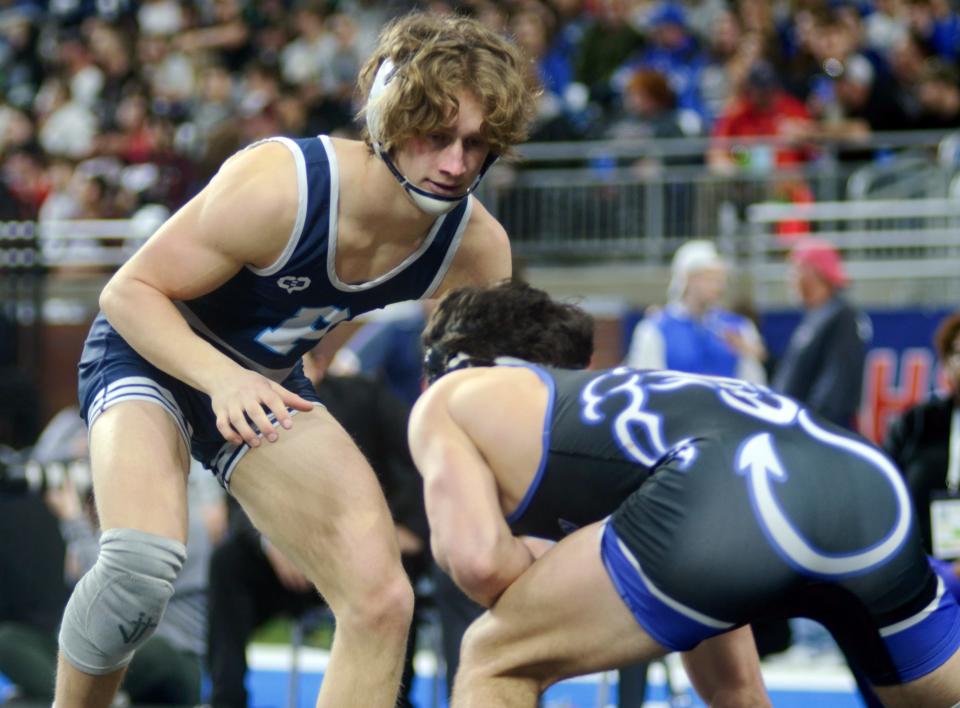 Petoskey senior Trevor Swiss wrestles Jack Conley of Lake Fenton in the 150-pound state championship Saturday at Ford Field.
