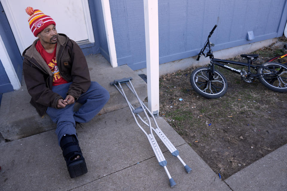 Jacob Gooch talks about being shot in the leg during Wednesday's Super Bowl victory rally for the Kansas City Chiefs while recovering at his home in Leavenworth, Kan., Thursday, Feb. 15, 2024. Gooch, along with his wife and his son, were among the more than 20 people injured in the incident that also resulted in one death. (AP Photo/Charlie Riedel)