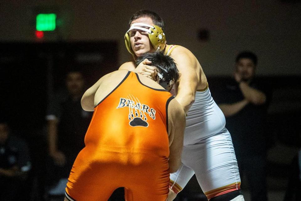 Golden Valley’s Trytin Gastelum wrestles Merced’s Julian Mora during a match at Golden Valley High School in Merced, Calif., on Tuesday, Jan. 23, 2024.