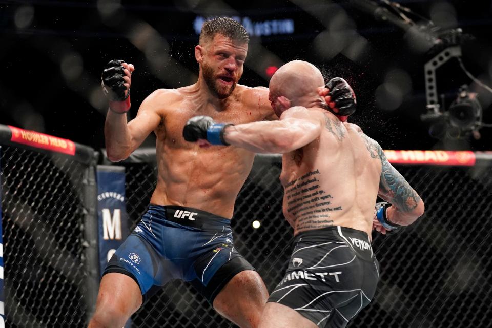 After a slow first round, UFC featherweights Calvin Kattar, left, and Josh Emmett engaged in four rounds of fury, resulting in Emmett gaining the split decision win. The Austin Fight Night card at the new Moody Center drew 13,689 fans.
