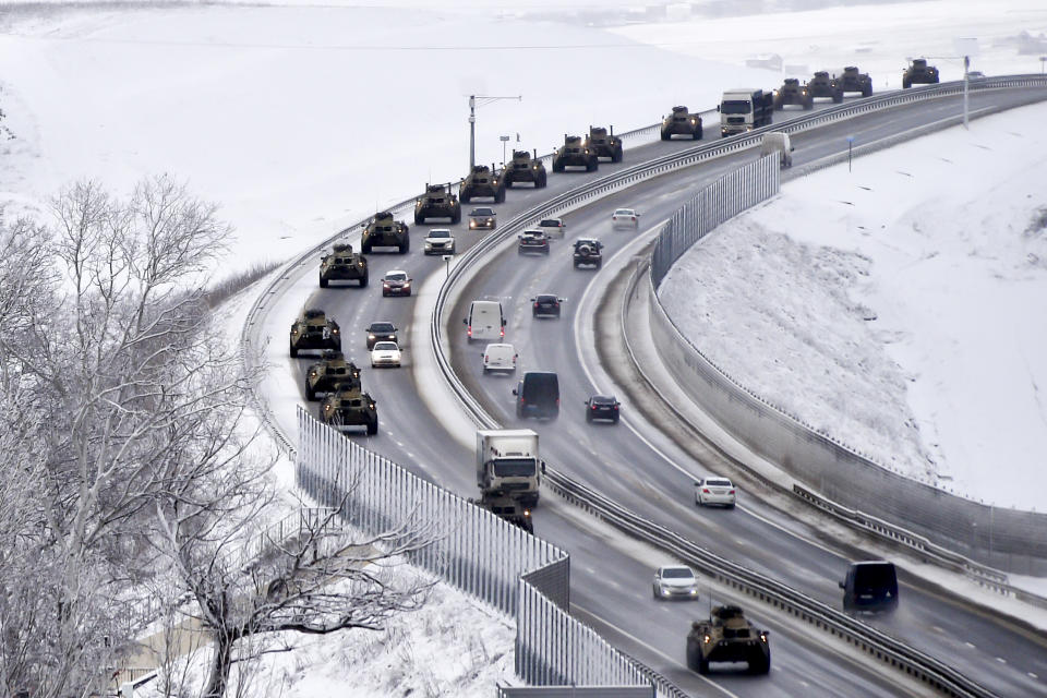 FILE - A convoy of Russian armored vehicles moves along a highway in Crimea, on Jan. 18, 2022. Russia's present demands are based on Putin's purported long sense of grievance and his rejection of Ukraine and Belarus as truly separate, sovereign countries but rather as part of a Russian linguistic and Orthodox motherland. (AP Photo, File)