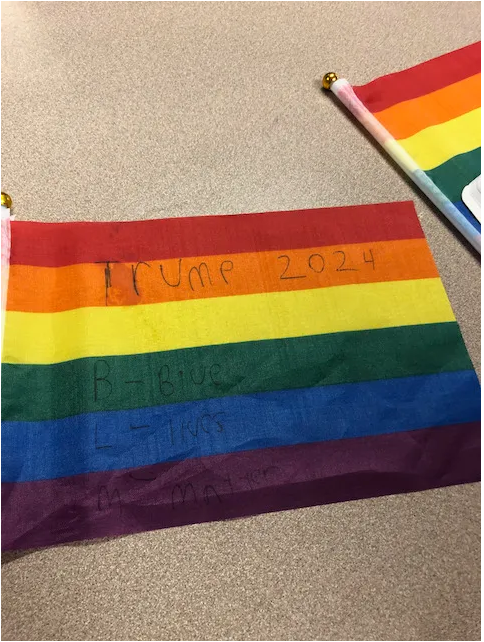 David Simmons says his daughter was the subject of harassment when a fellow student presented a LGBTQ+ pride flag with the words “Trump 2024” and “B — Blue, L — Lives, M — Matter" written on it.