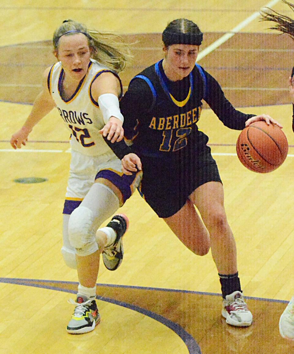 Aberdeen Central's Taryn Hettich is fouled by Watertown's Jaida Young during their high school girls basketball game on Monday, Feb. 20, 2023 in the Watertown Civic Arena.