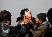 <p>An Afghan man mourns inside a hospital compound after a suicide attack in Kabul, Afghanistan, Dec.28, 2017. (Photo: Mohammad Ismail/Reuters) </p>