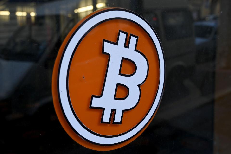 The logo of Bitcoin digital currency is pictured on the front door of an ATM in Marseille, southern France (AFP via Getty Images)