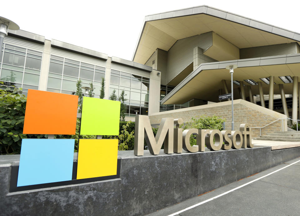 FILE - This July 3, 2014 file photo shows Microsoft Corp. signage outside the Microsoft Visitor Center in Redmond, Wash. The volume of option contracts to buy or sell Microsoft and Tesla shares is up more than twofold from 2019, while Apple option contract volume is up more than 86%. (AP Photo/Ted S. Warren, File)