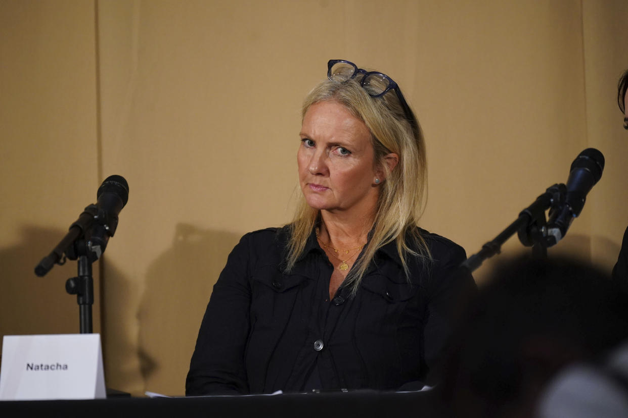 One of Mr Al Fayed's accusers, Natacha (no surname given), who featured in 'Al-Fayed: Predator at Harrods', looks on during a press conference to discuss their involvement in the investigation and the legal claim against Harrods for failing to provide a safe system of work for their employees, at Kent House in Knightsbridge, London, Friday Sept. 20, 2024. Multiple ex-Harrods employees have accused Mohamed Al Fayed, the Egyptian billionaire who owned the luxury department store for more than 25 years, of rape and sexual assault. (Yui Mok/PA via AP)