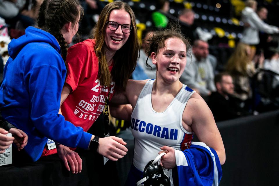 Decorah's Naomi Simon celebrates after scoring a fall at 170 pounds in the finals during of the Iowa Wrestling Coaches and Officials Association (IWCOA) girls' state wrestling tournament, Saturday, Jan. 22, 2022, at the Xtream Arena in Coralville, Iowa.